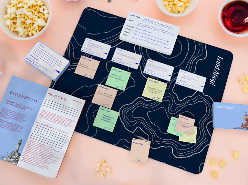 Game board with cards and markers on a table with snacks