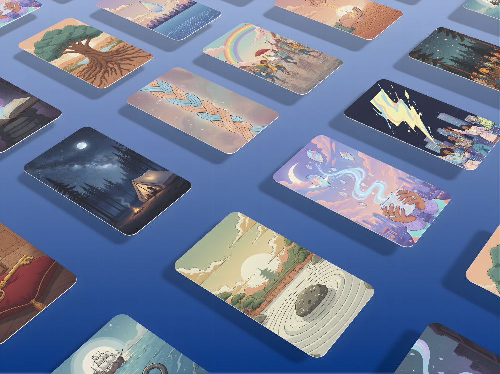 Collection of illustrated cards on a blue surface
