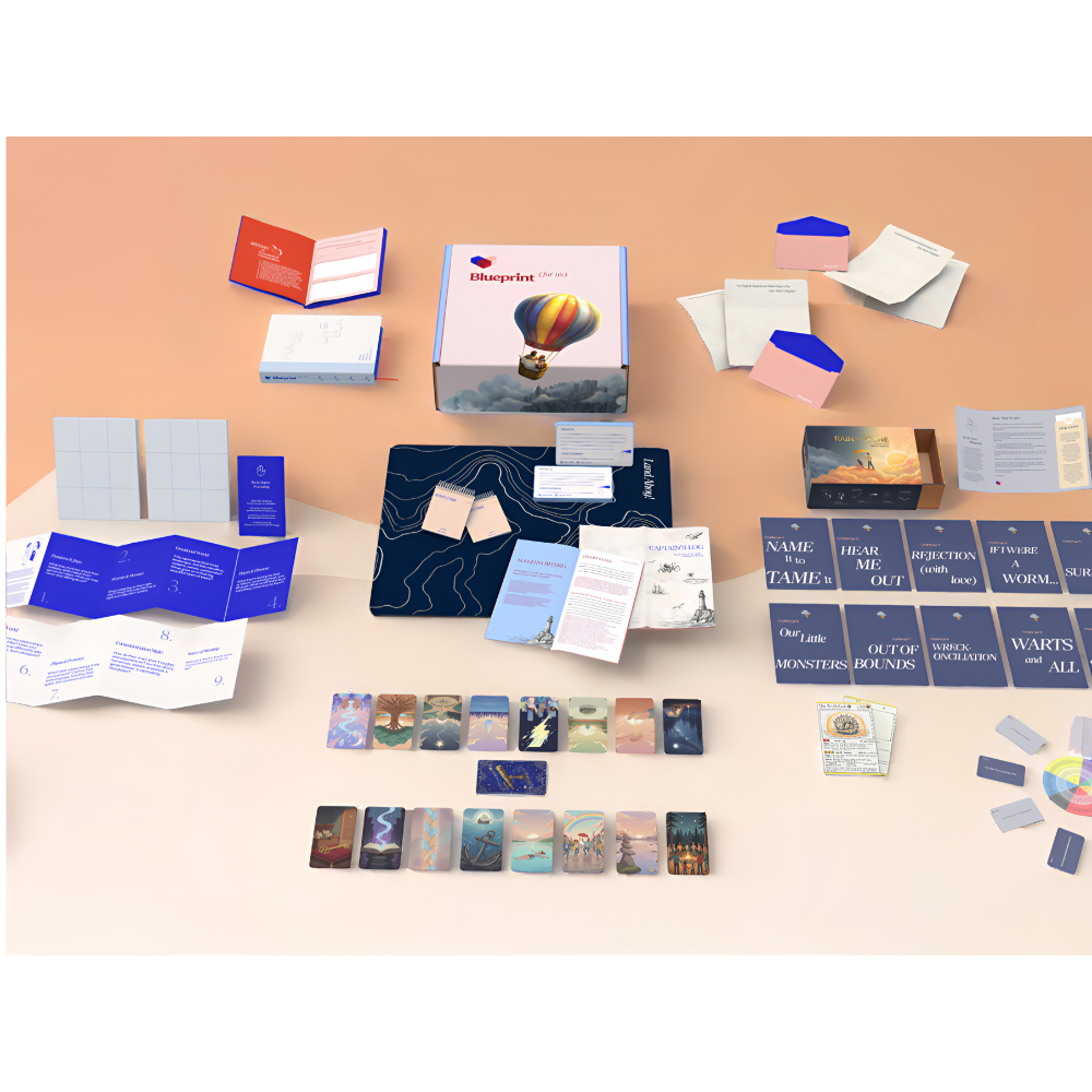 Collection of cards and boxes on a peach-colored background